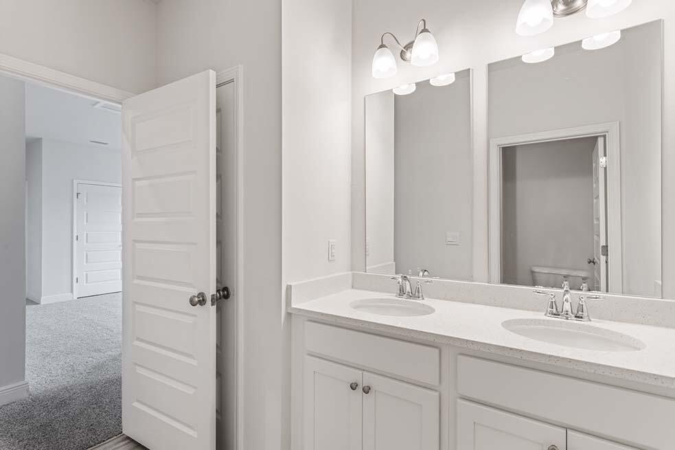 44 Oak Trees Lane West Freeport, FL 32439 - Photo 20 of 23 a bathroom with a double vanity sink mirror and vanity