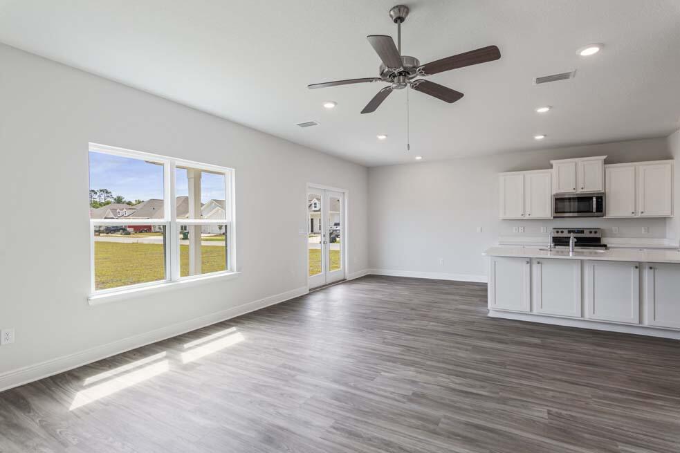 44 Oak Trees Lane West Freeport, FL 32439 - Photo 4 of 23 a view of an empty room with a window and wooden floor