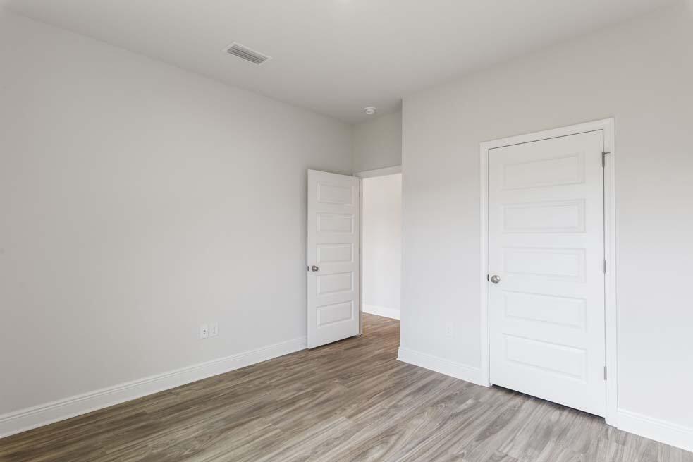 44 Oak Trees Lane West Freeport, FL 32439 - Photo 8 of 23 a view of an empty room with wooden floor
