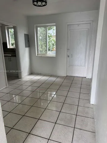 a view of an empty room and window