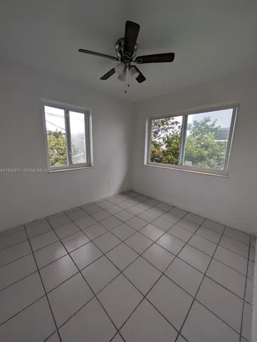 a view of an empty room and window