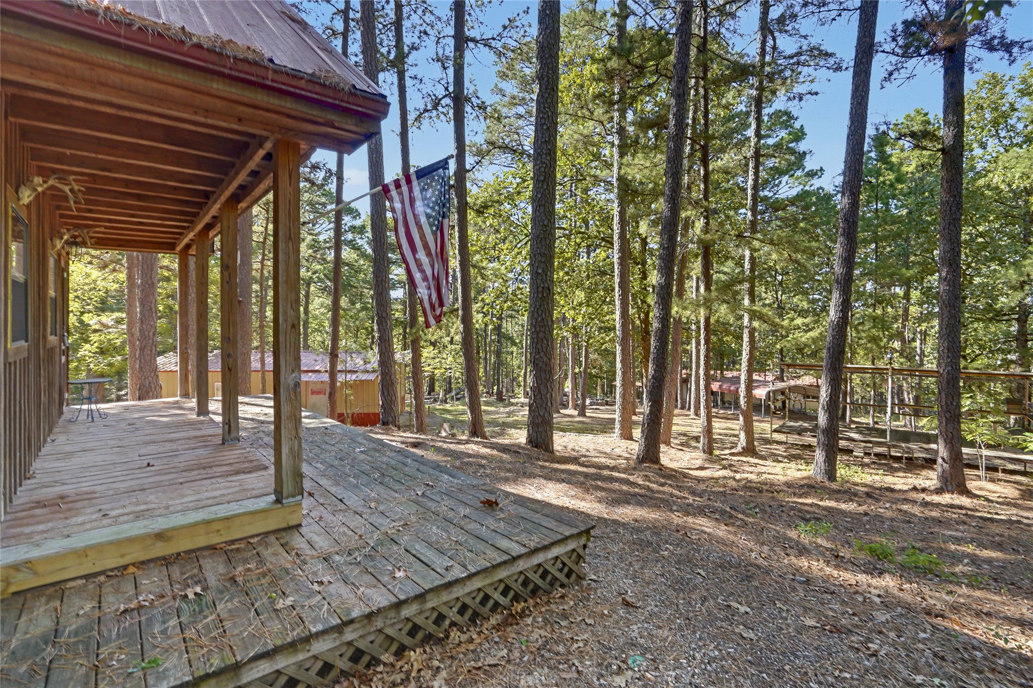 46420 South 590 Road Jay, OK 74346 - Photo 4 of 63 Wood-sided exterior with a covered porch and wood decking