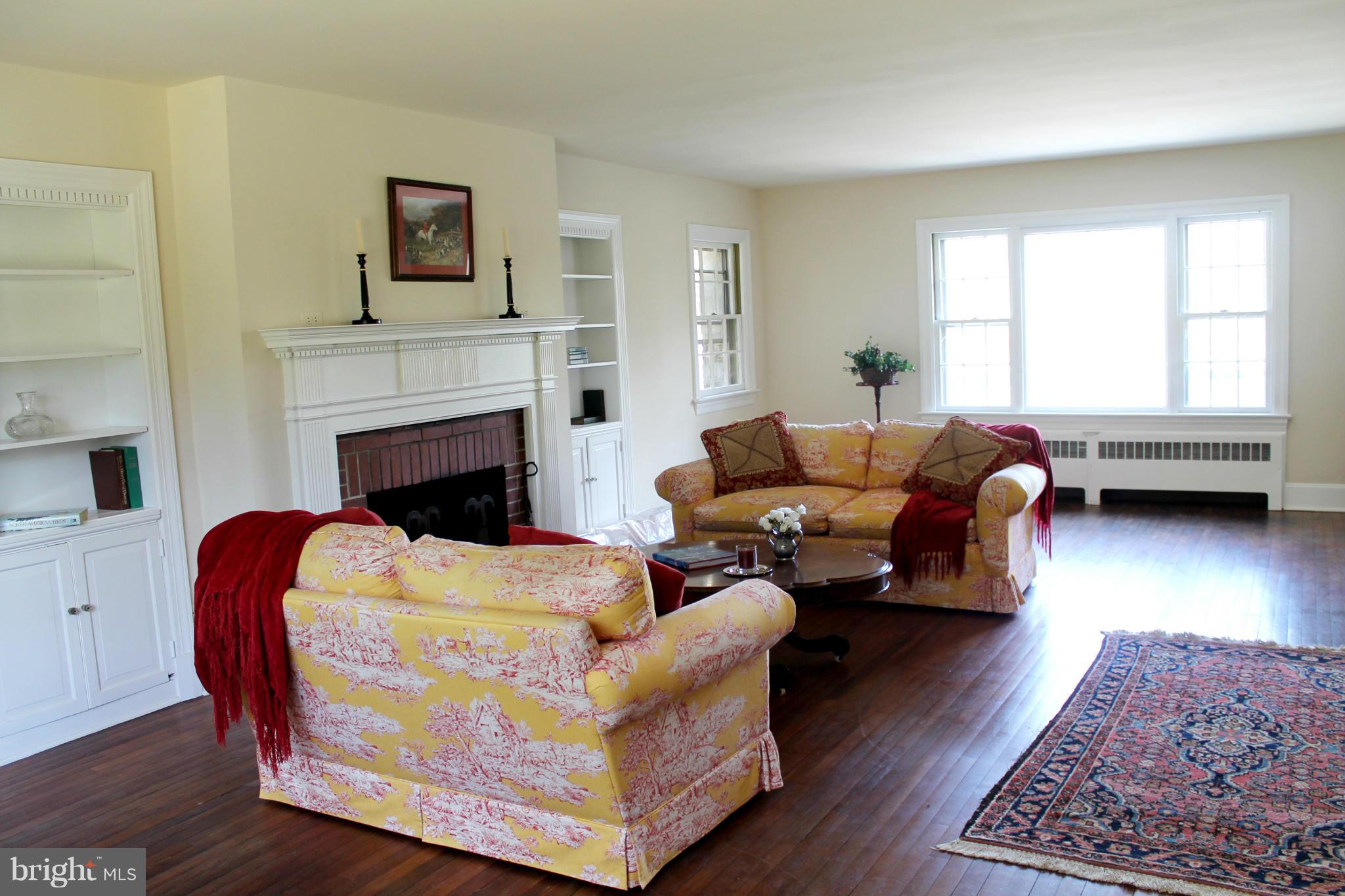18082 Raven Rocks Road Round Hill, VA 20141 - Photo 3 of 9 a living room with furniture and a fireplace
