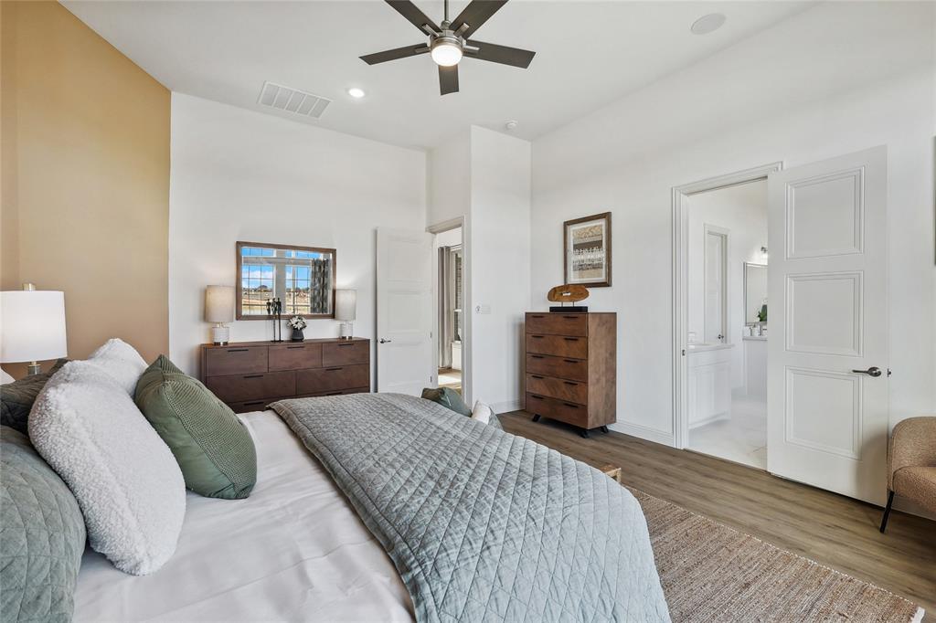1604 Casting Ridge Mesquite, TX 75181 - Photo 18 of 38 Spacious interior featuring wood-finish flooring, a contemporary ceiling fan, recessed lighting, and a neutral color palette