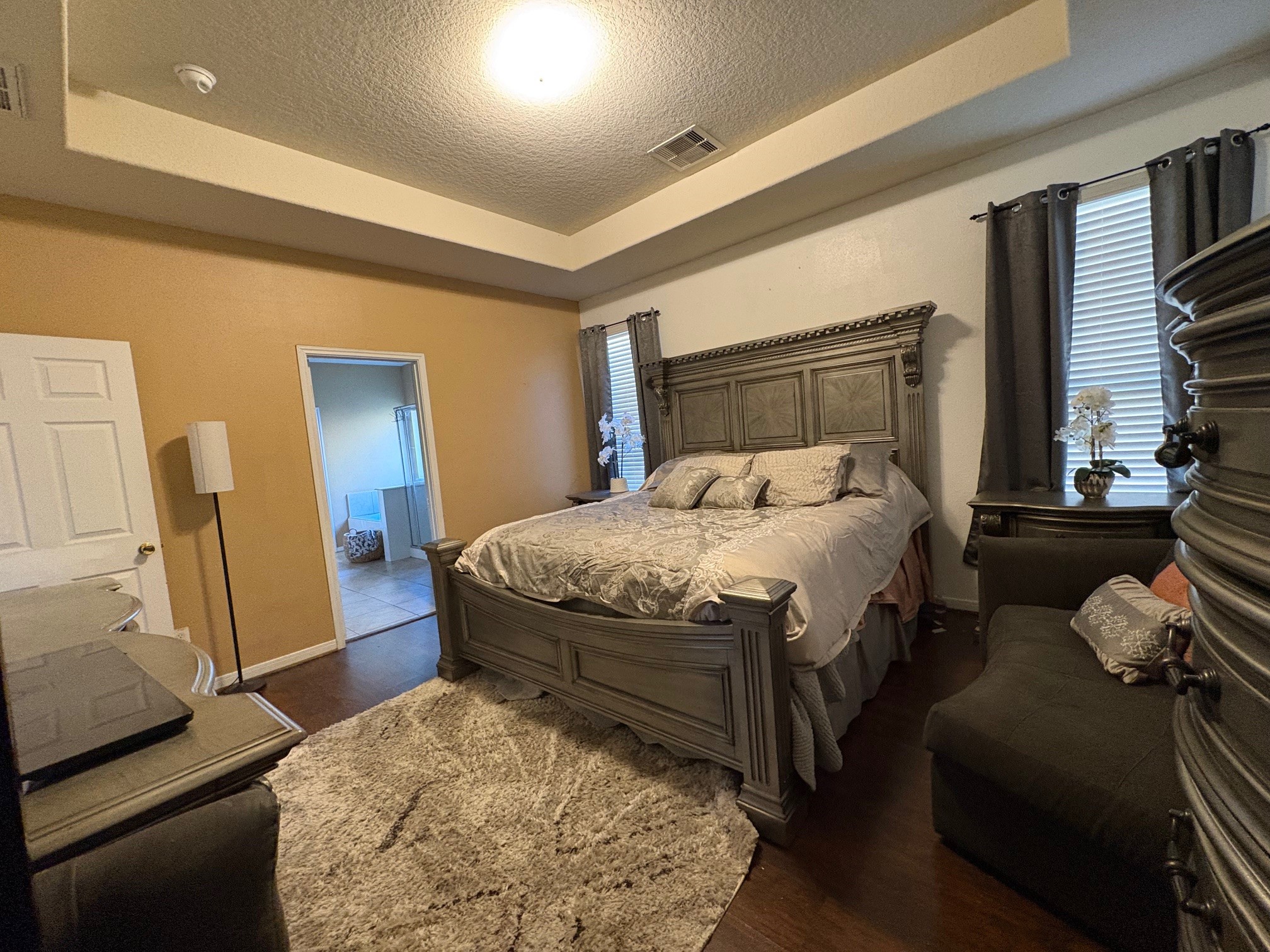 5915 Annatto Drive Baytown, TX 77521 - Photo 16 of 31 a bedroom with a bed and a dresser with rug