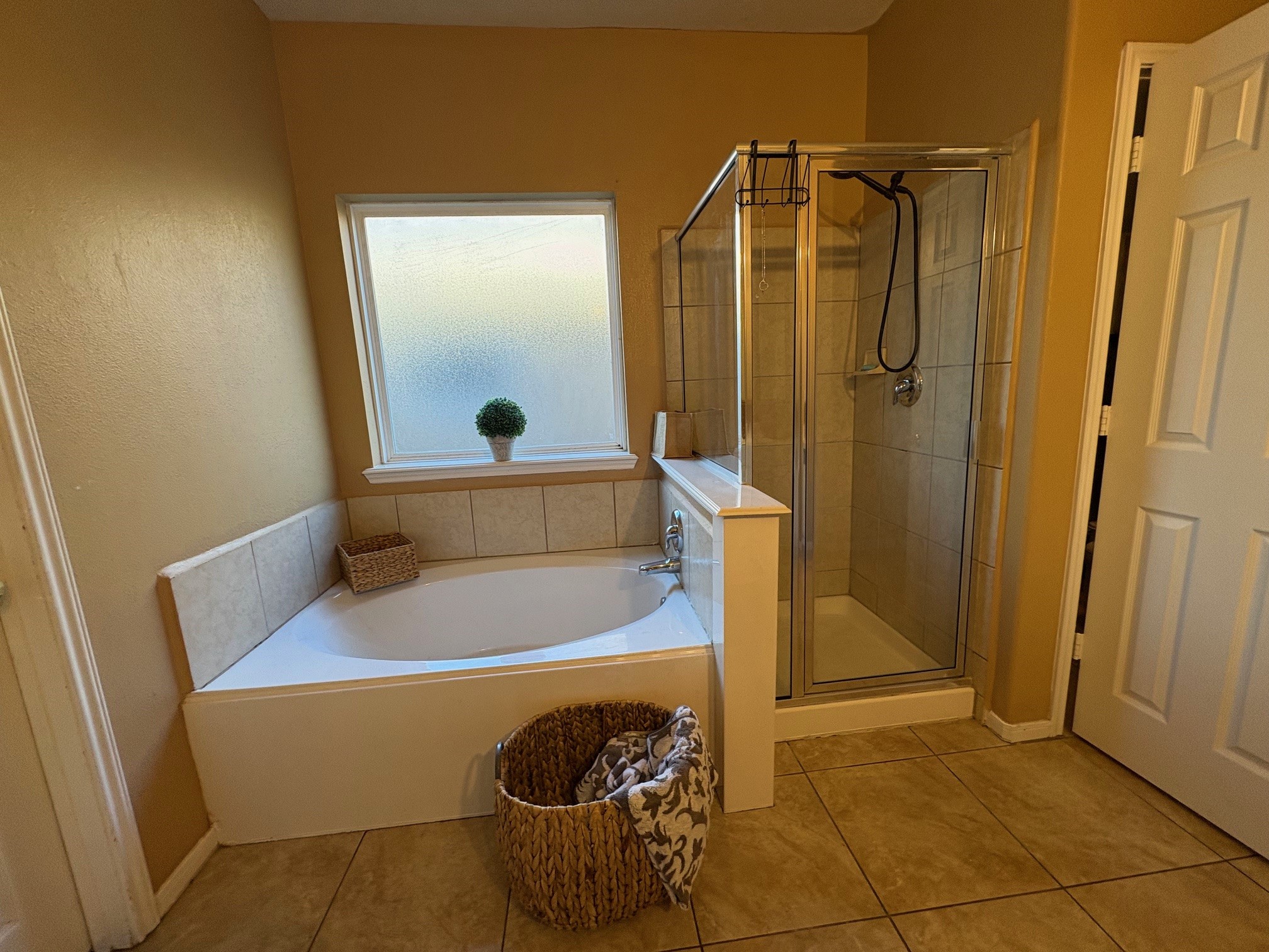 5915 Annatto Drive Baytown, TX 77521 - Photo 18 of 31 a bathroom with a tub and a shower