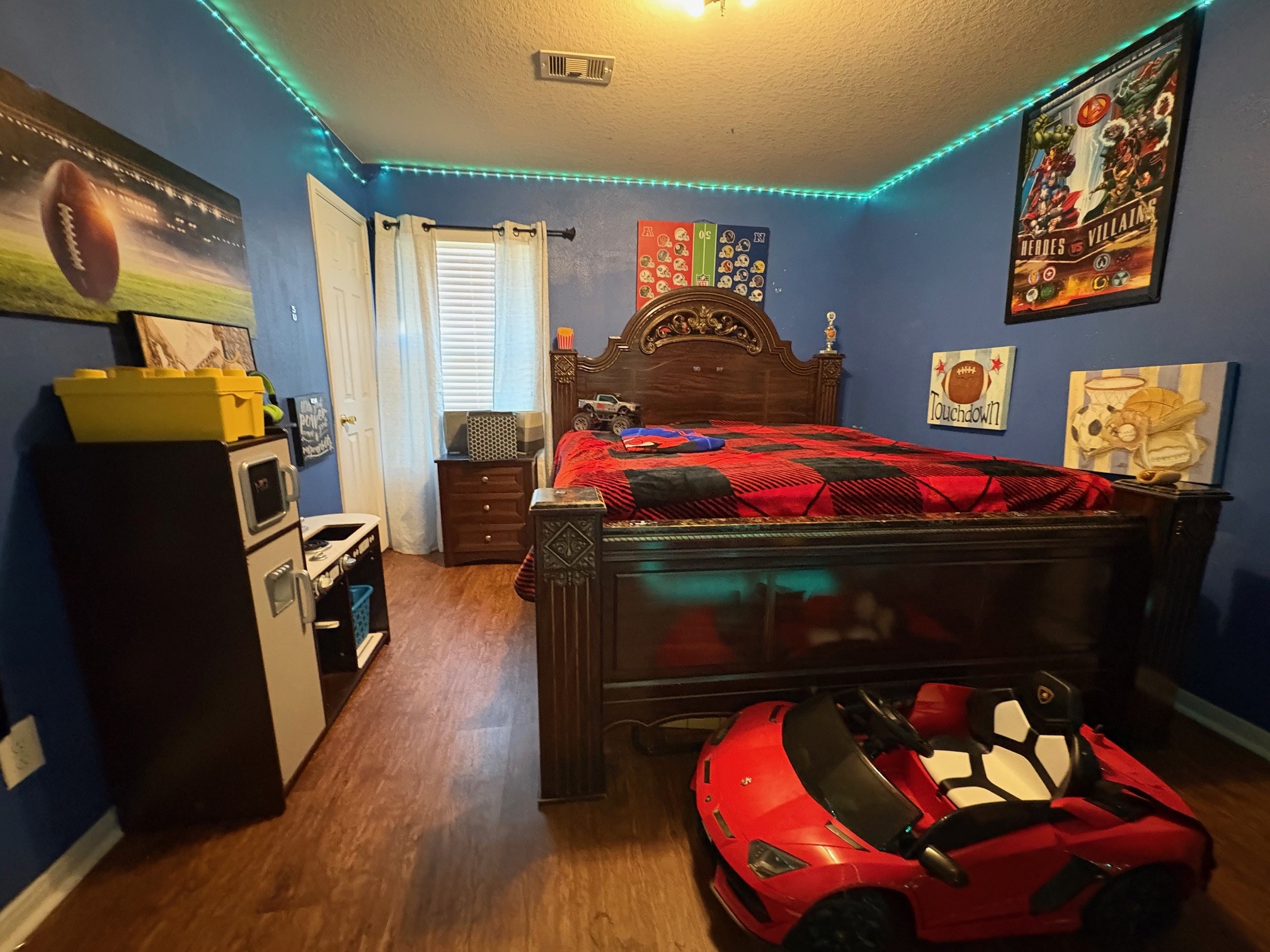 5915 Annatto Drive Baytown, TX 77521 - Photo 24 of 31 a bedroom with a bed and wooden floor