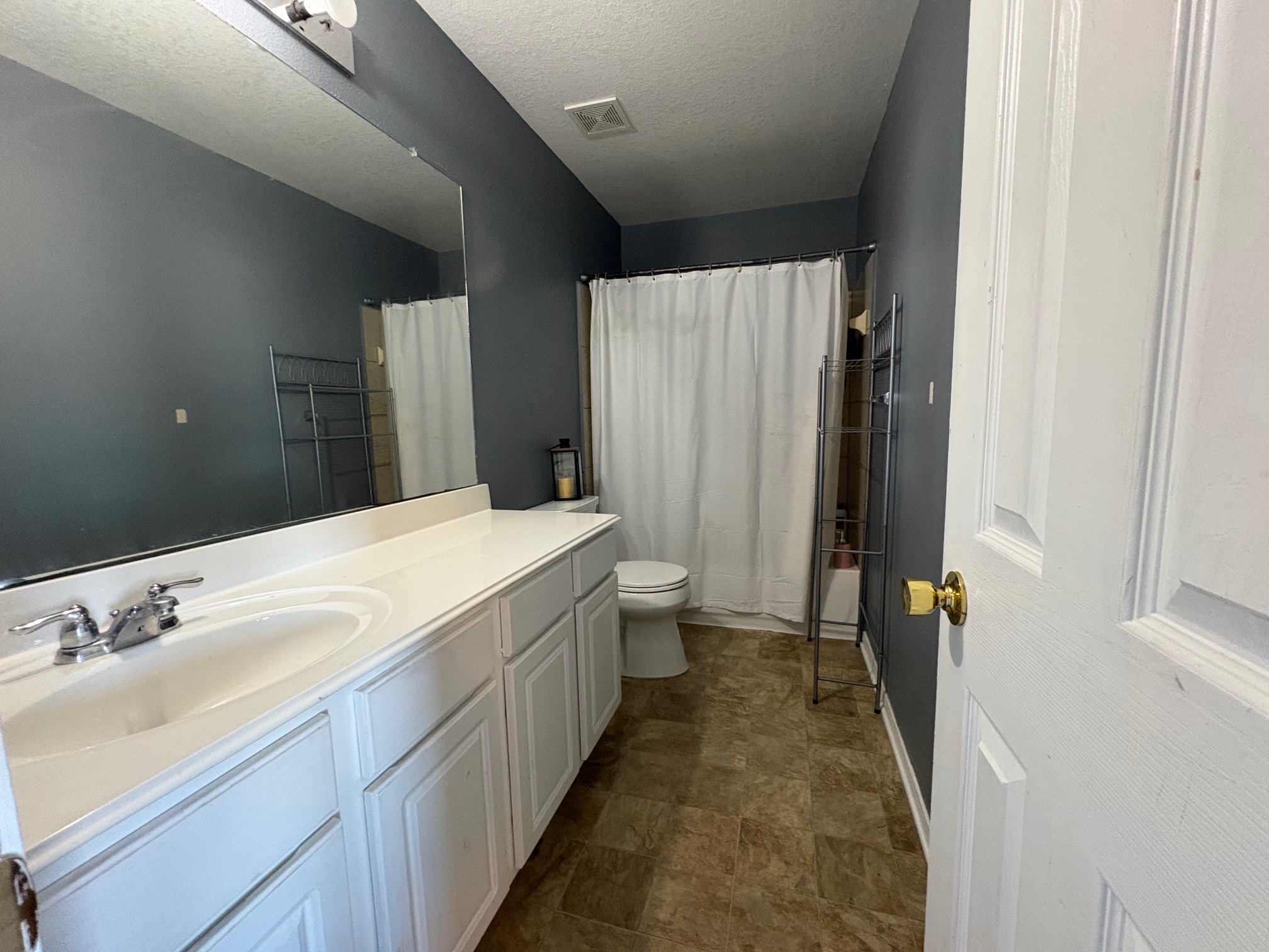 5915 Annatto Drive Baytown, TX 77521 - Photo 27 of 31 a bathroom with a sink a toilet and shower
