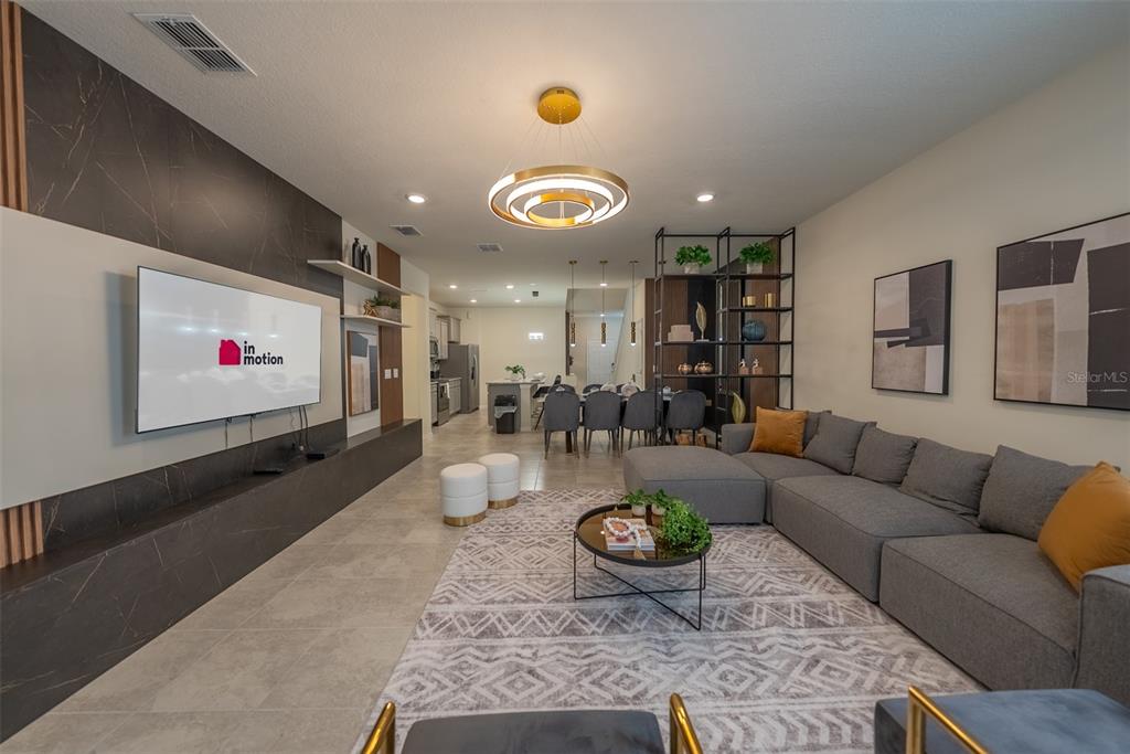 4470 Kaipo Road Davenport, FL 33897 - Photo 6 of 34 a living room with furniture and a flat screen tv