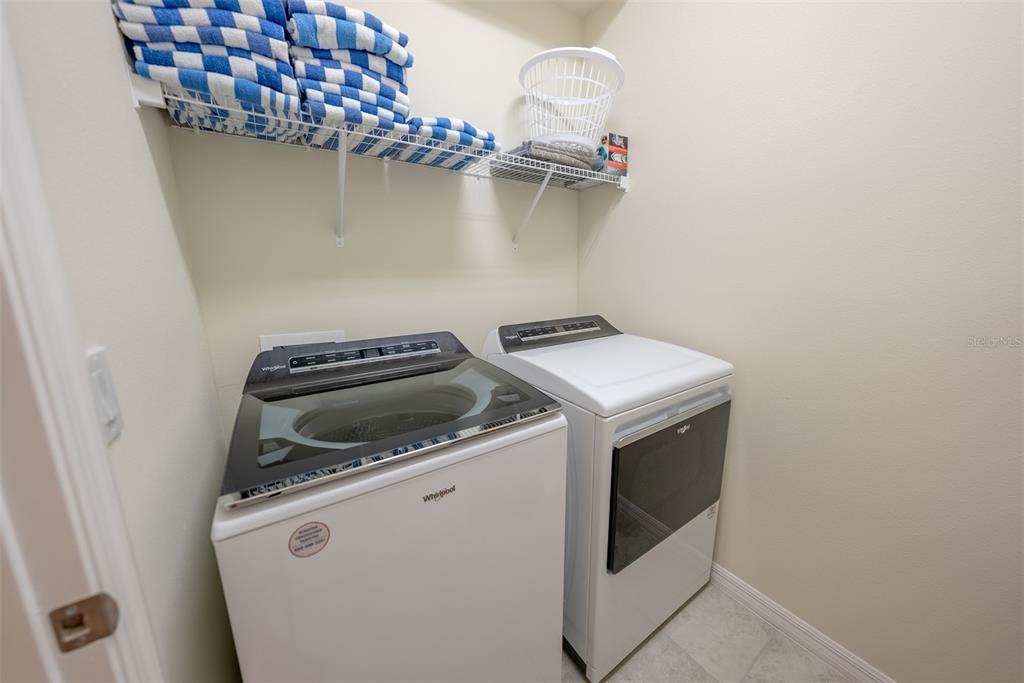 4470 Kaipo Road Davenport, FL 33897 - Photo 10 of 34 a utility room with dryer and washer