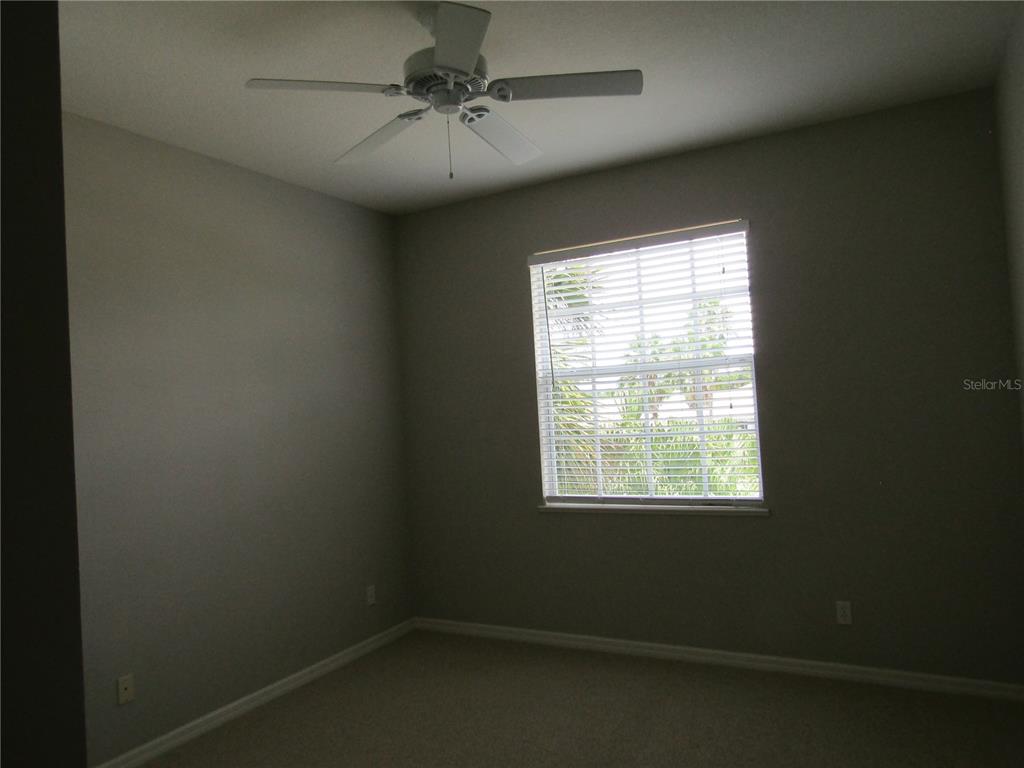 1669 Monarch Drive, Unit 204 Venice, FL 34293 - Photo 13 of 17 an empty room with a window