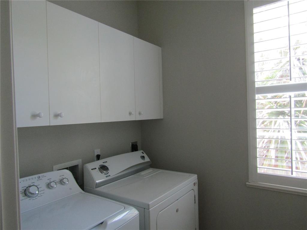 1669 Monarch Drive, Unit 204 Venice, FL 34293 - Photo 16 of 17 a utility room with dryer and washer