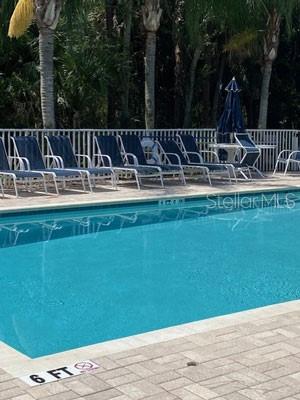 1669 Monarch Drive, Unit 204 Venice, FL 34293 - Photo 17 of 17 a view of a table and chairs in patio