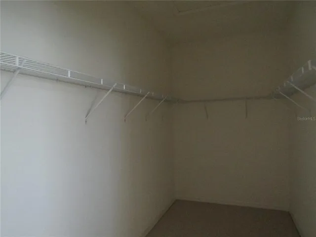 a bathroom with a double vanity sink and mirror