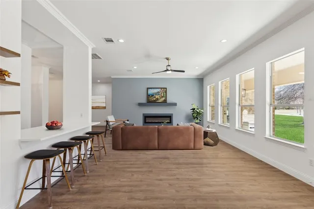 a large room with furniture and wooden floor