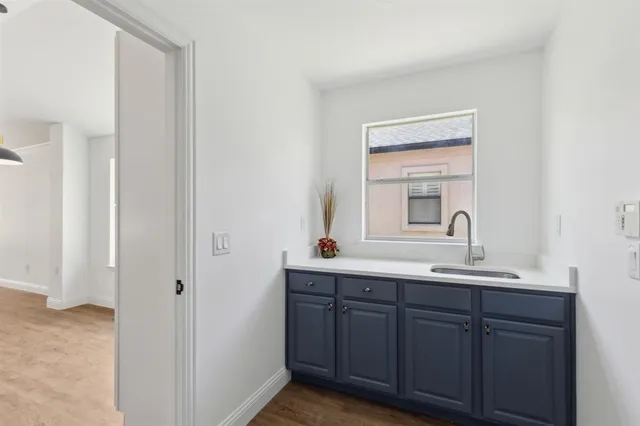 a bathroom with a double vanity sink and mirror