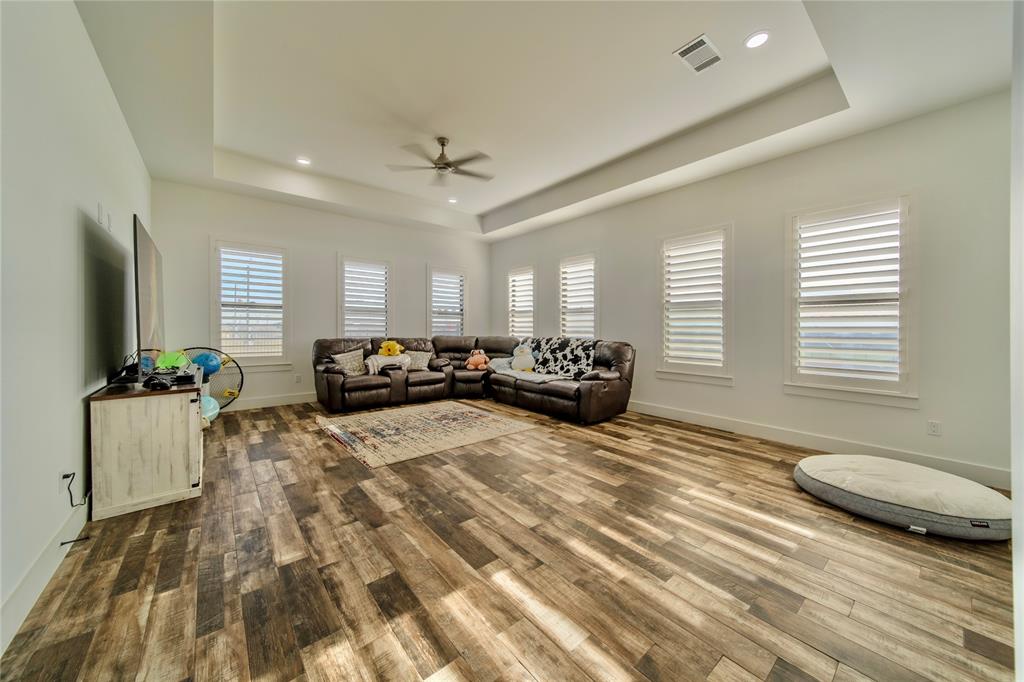 165 Ranch House Road Rockwall, TX 75032 - Photo 22 of 40 a bed room with a bed window and a television