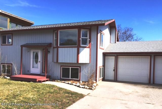 600 Hutton Avenue Rifle, CO 81650 - Photo 1 of 10 a front view of a house with a yard