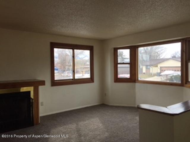 600 Hutton Avenue Rifle, CO 81650 - Photo 2 of 10 an empty room with windows