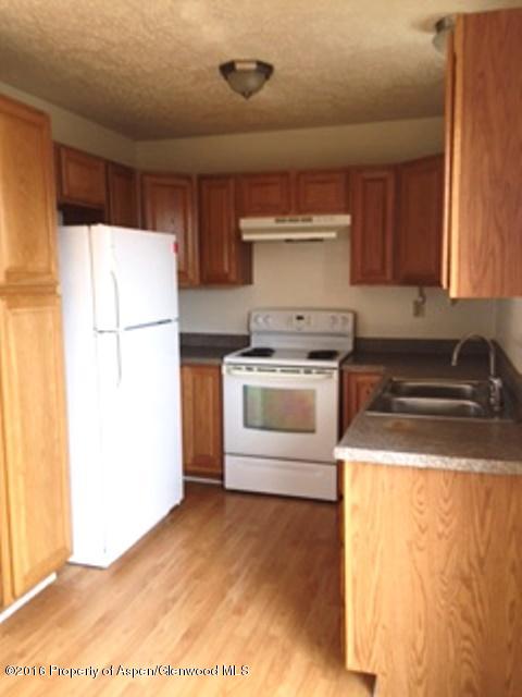 600 Hutton Avenue Rifle, CO 81650 - Photo 5 of 10 a kitchen with a stove a refrigerator and a sink