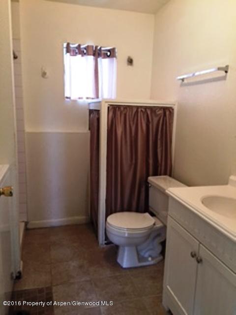 600 Hutton Avenue Rifle, CO 81650 - Photo 8 of 10 a bathroom with a toilet a sink and a window