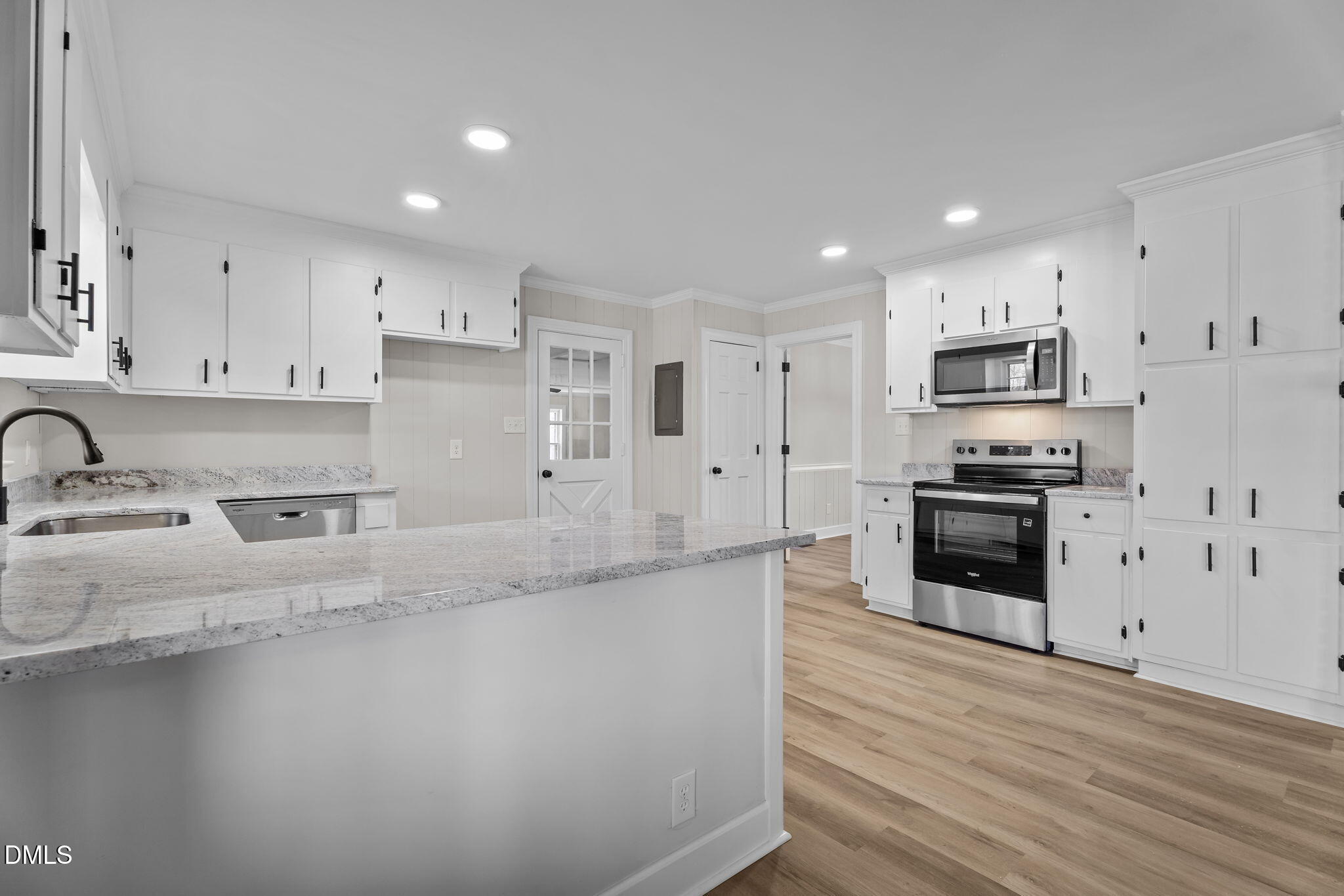 3738 Red Oak Battleboro Road Battleboro, NC 27809 - Photo 12 of 53 a kitchen with granite countertop a refrigerator and a stove top oven