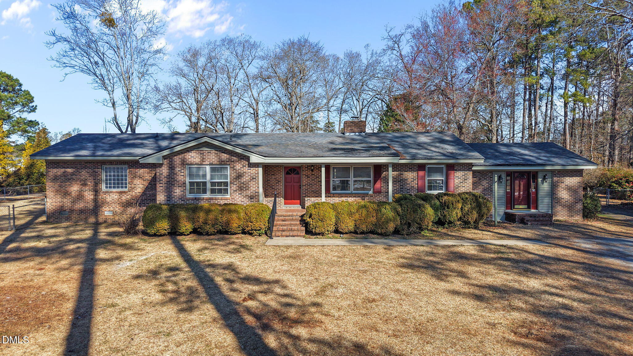 3738 Red Oak Battleboro Road Battleboro, NC 27809 - Photo 2 of 53 a front view of a house with a yard outdoor seating and covered with trees