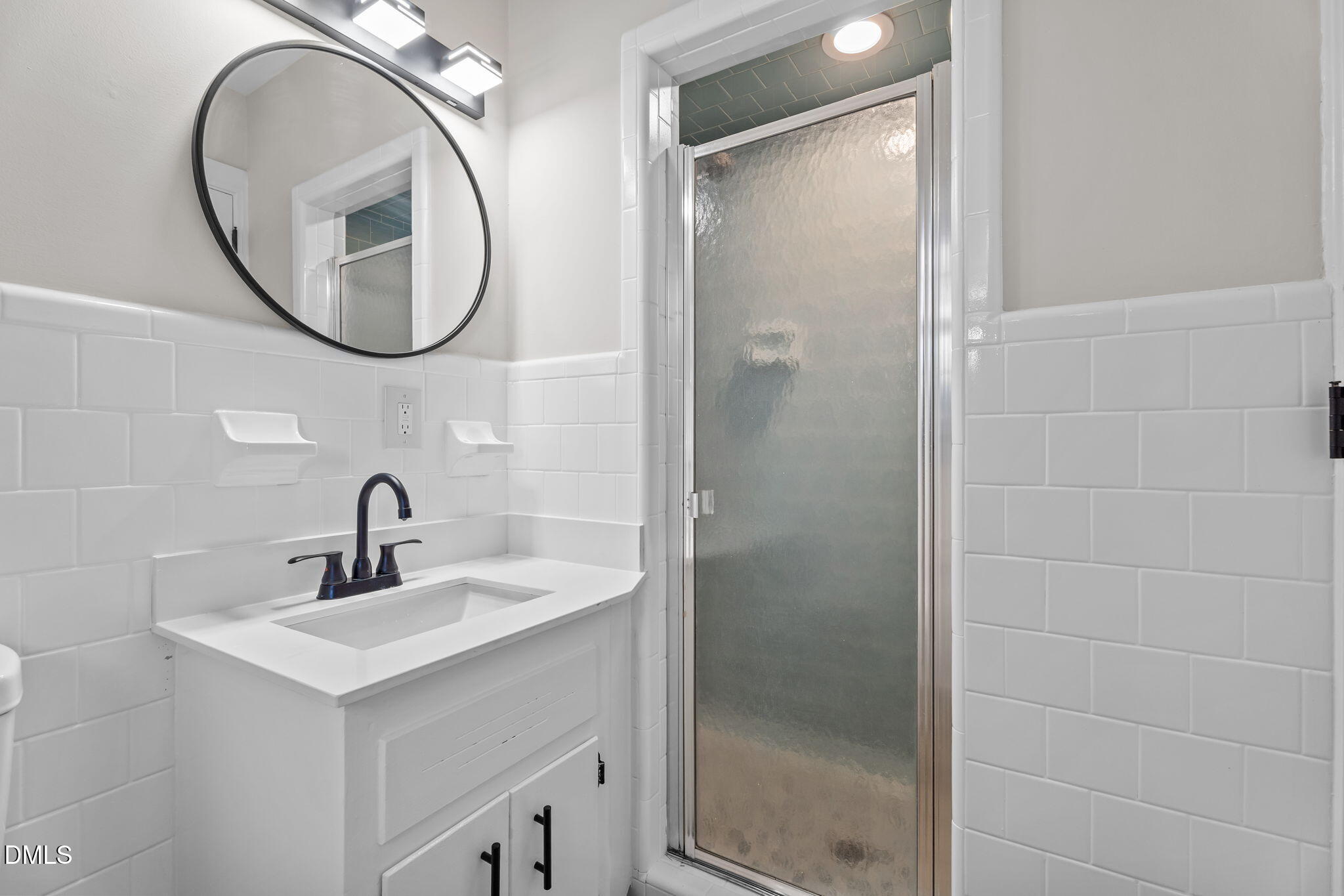 3738 Red Oak Battleboro Road Battleboro, NC 27809 - Photo 21 of 53 a bathroom with a sink and a mirror
