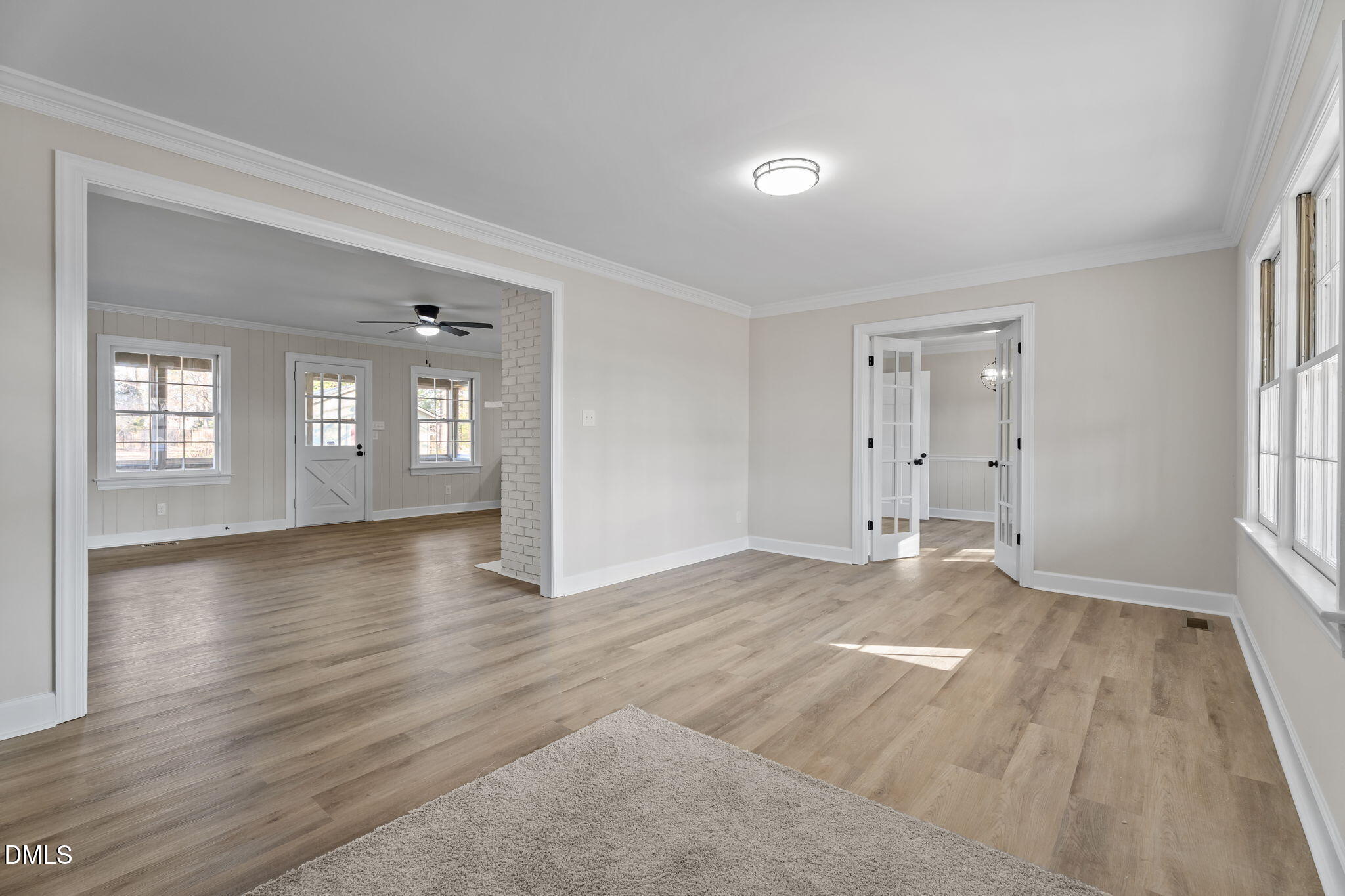 3738 Red Oak Battleboro Road Battleboro, NC 27809 - Photo 3 of 53 a view of an empty room with window and wooden floor