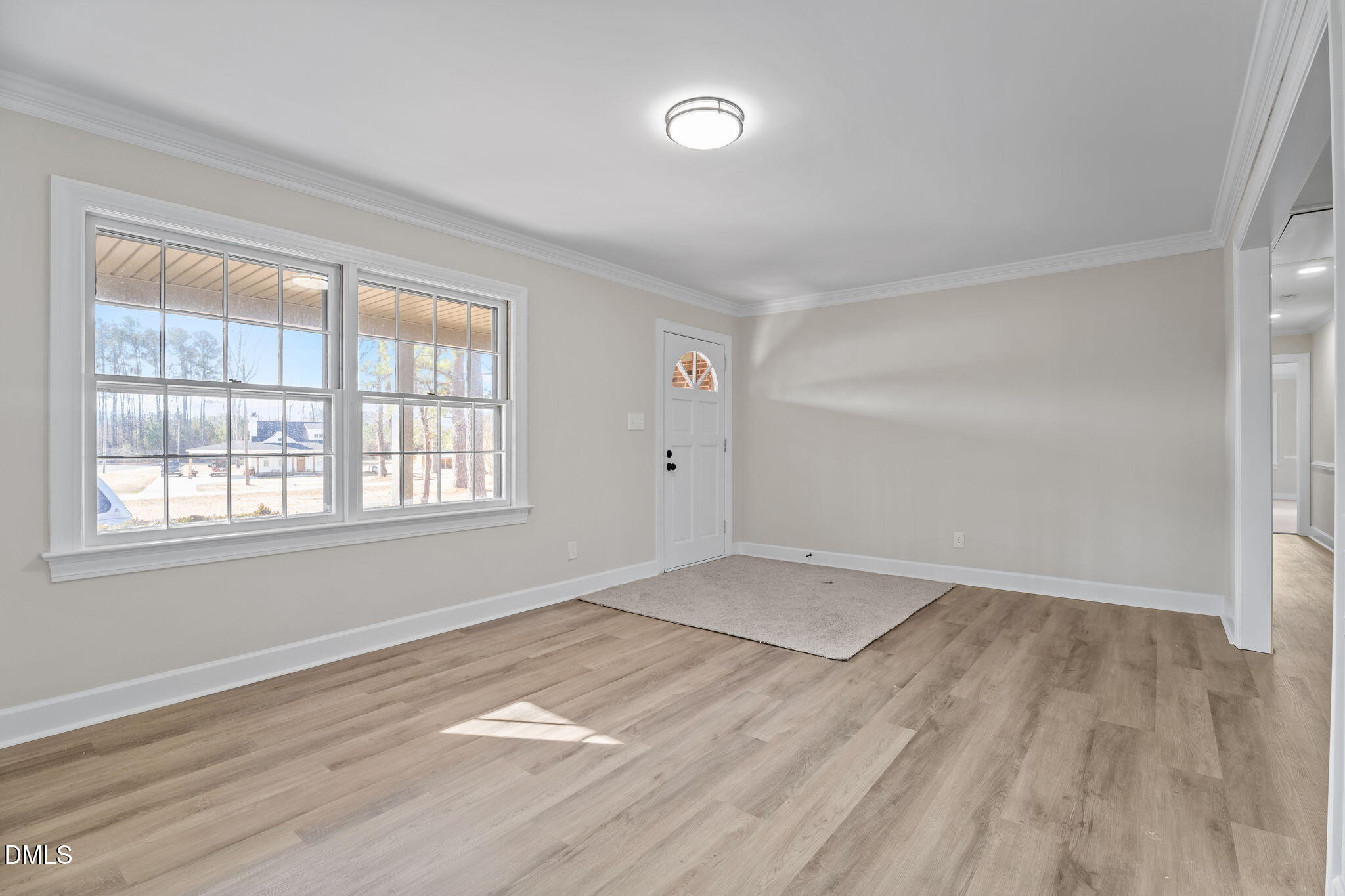 3738 Red Oak Battleboro Road Battleboro, NC 27809 - Photo 4 of 53 an empty room with wooden floor and windows