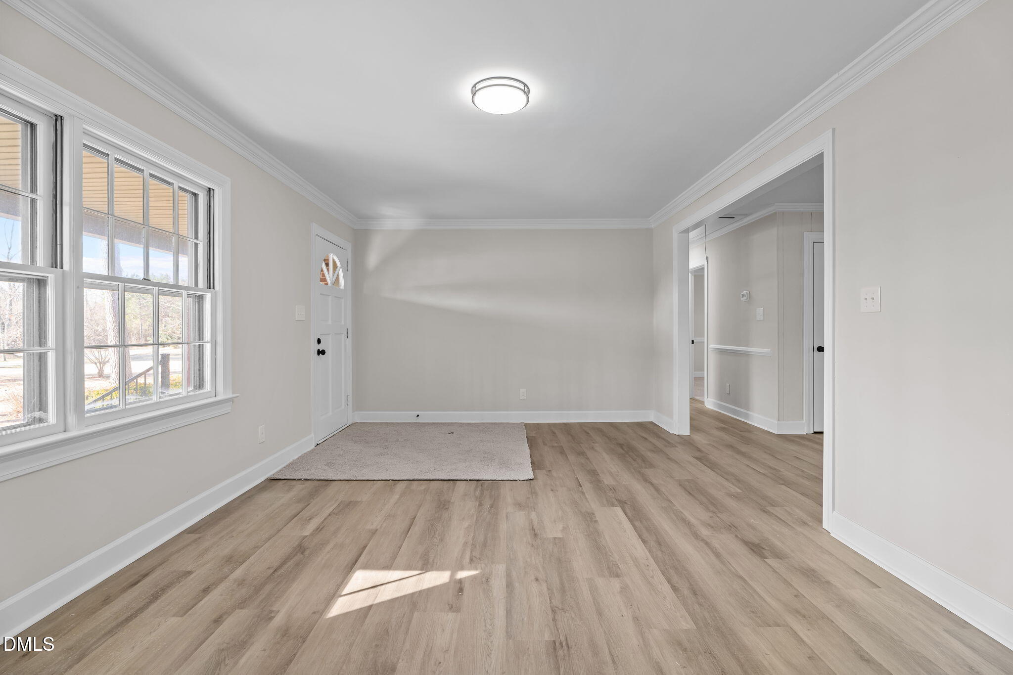 3738 Red Oak Battleboro Road Battleboro, NC 27809 - Photo 5 of 53 an empty room with wooden floor and windows