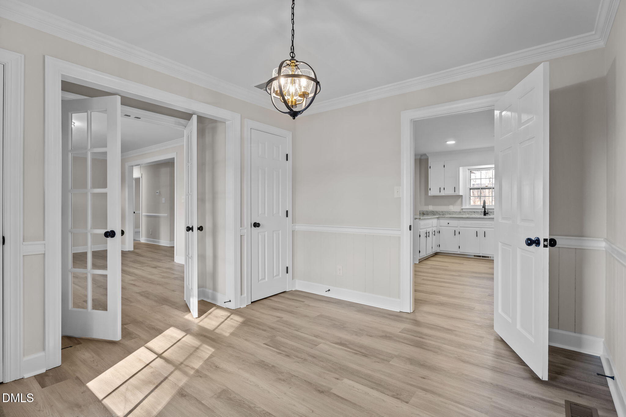3738 Red Oak Battleboro Road Battleboro, NC 27809 - Photo 7 of 53 a view of a hallway with wooden floor and a chandelier