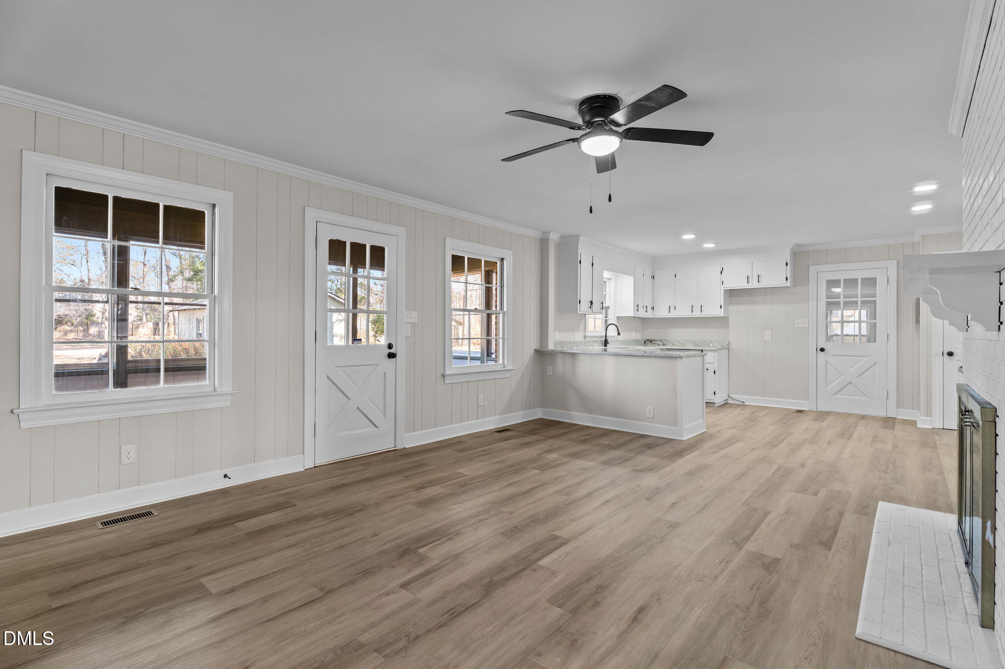 3738 Red Oak Battleboro Road Battleboro, NC 27809 - Photo 9 of 53 a view of an empty room with a window and wooden floor
