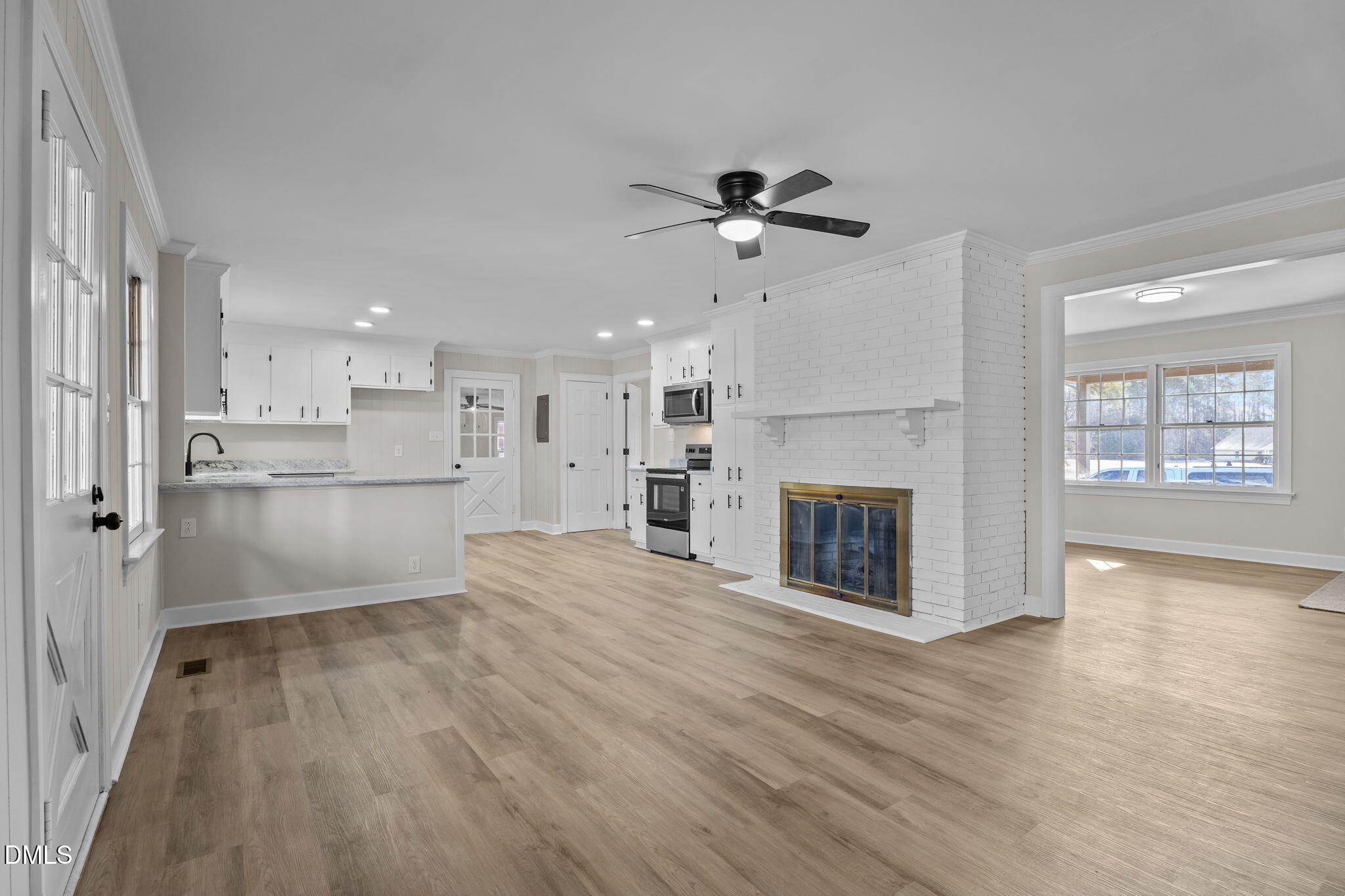 3738 Red Oak Battleboro Road Battleboro, NC 27809 - Photo 10 of 53 a view of a kitchen with wooden floor and a kitchen