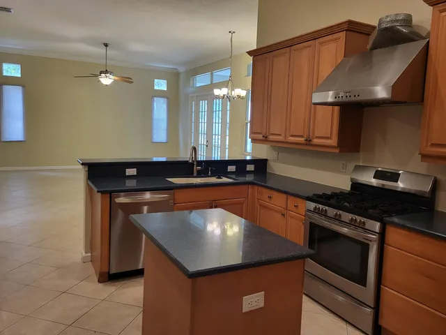 a kitchen with a sink and a stove