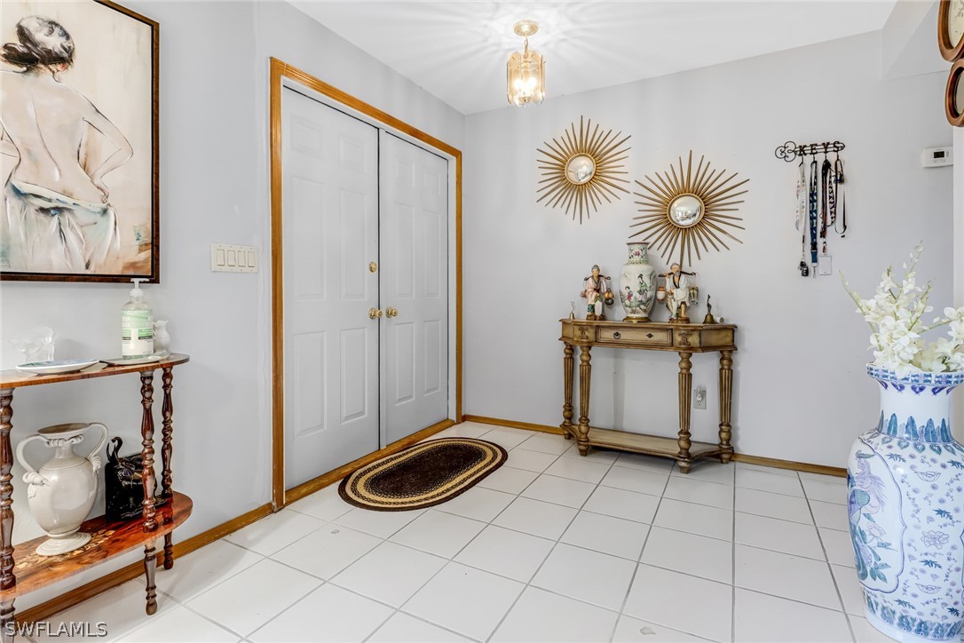 7523 Morgan Road Fort Myers, FL 33967 - Photo 4 of 25 a view of a livingroom with furniture and chandelier fan