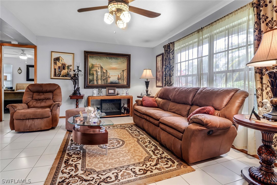 7523 Morgan Road Fort Myers, FL 33967 - Photo 6 of 25 a living room with furniture and a large window