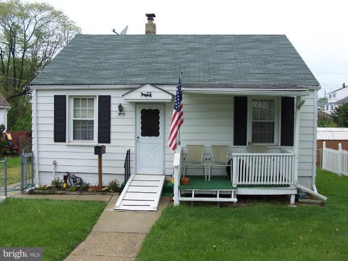 319 Trappe Road Baltimore, MD 21222 - Photo 1 of 8 a front view of a house with a garden