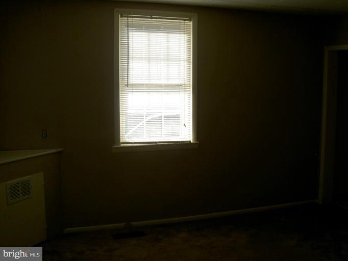 319 Trappe Road Baltimore, MD 21222 - Photo 8 of 8 a view of an empty room with a window