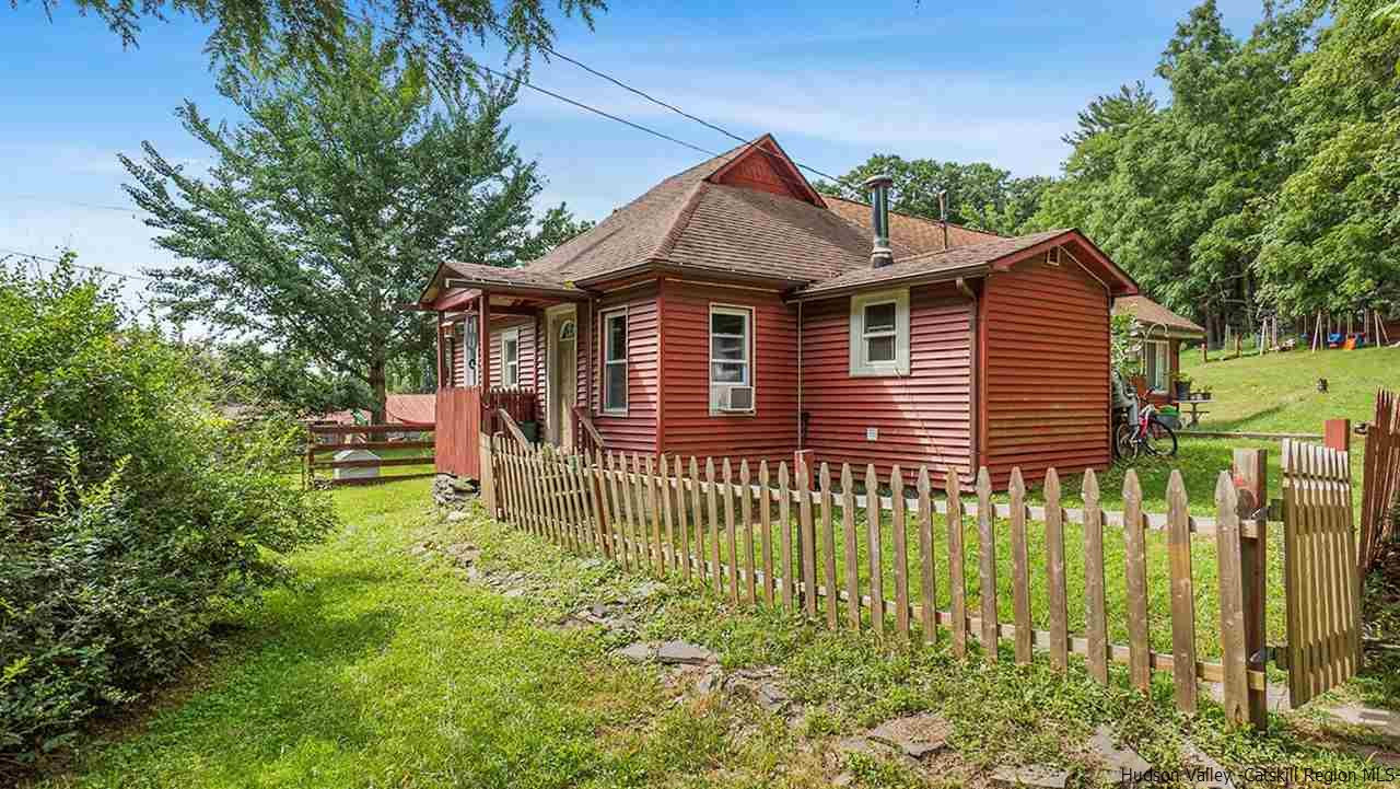 879 Samsonville Road Kerhonkson, NY 12446 - Photo 16 of 16 a front view of a house with a garden