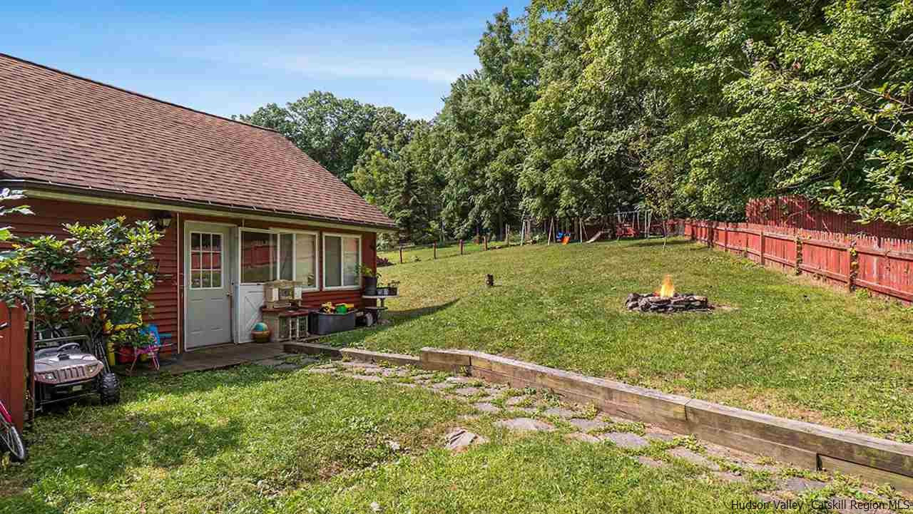 879 Samsonville Road Kerhonkson, NY 12446 - Photo 4 of 16 a view of a house with a backyard and sitting area