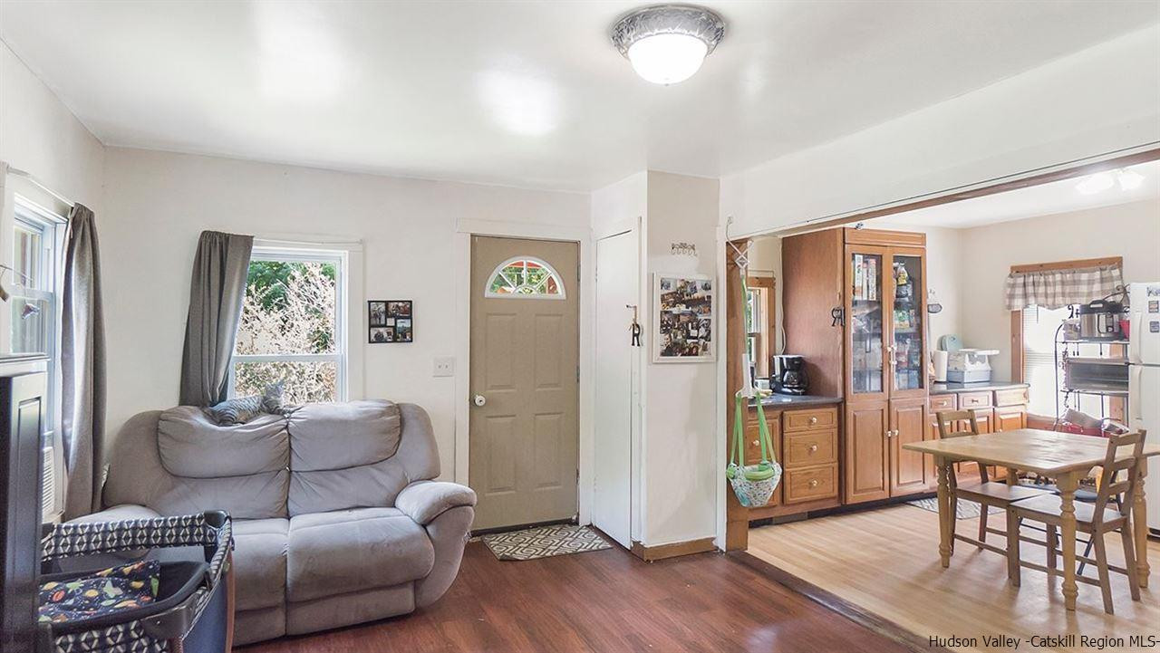 879 Samsonville Road Kerhonkson, NY 12446 - Photo 5 of 16 a living room with furniture and a large window