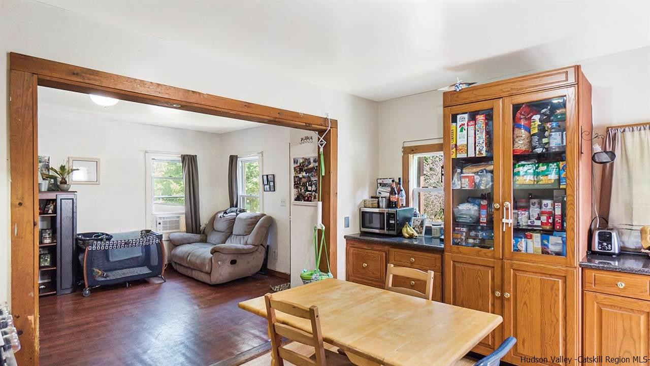 879 Samsonville Road Kerhonkson, NY 12446 - Photo 8 of 16 a living room with furniture and a large window