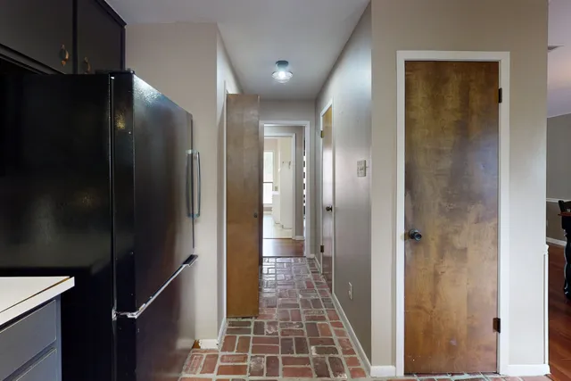 a bathroom with a glass door shower