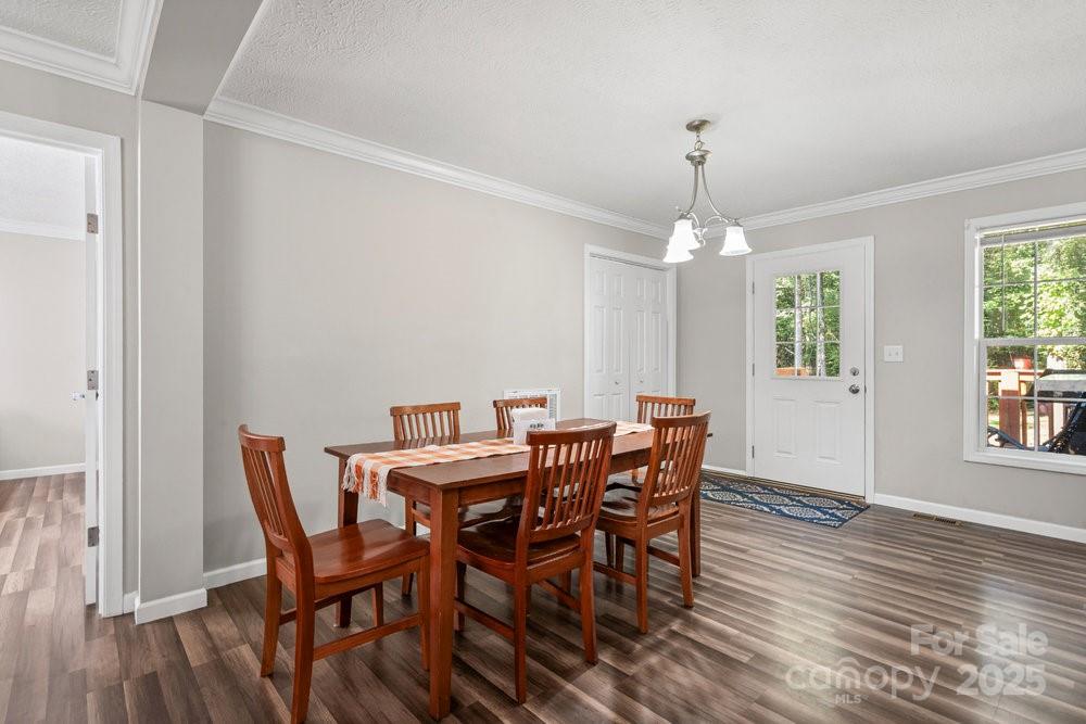 402 Shiloh Road Statesville, NC 28677 - Photo 14 of 34 a view of a dining room with furniture window and wooden floor