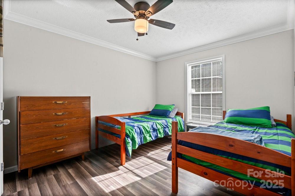 402 Shiloh Road Statesville, NC 28677 - Photo 19 of 34 a bedroom with two beds and a dresser
