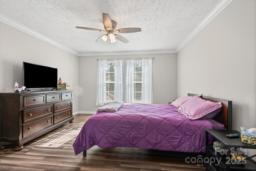 402 Shiloh Road Statesville, NC 28677 - Photo 24 of 34 a bedroom with a bed and a flat screen tv