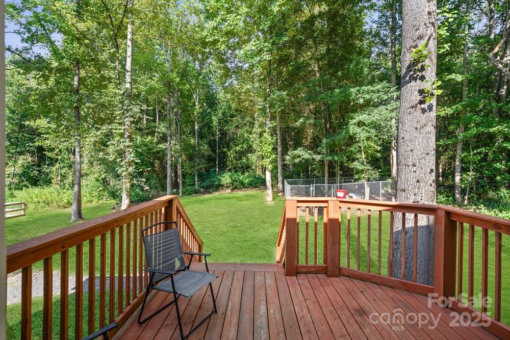 402 Shiloh Road Statesville, NC 28677 - Photo 30 of 34 a view of a balcony with wooden floor and fence