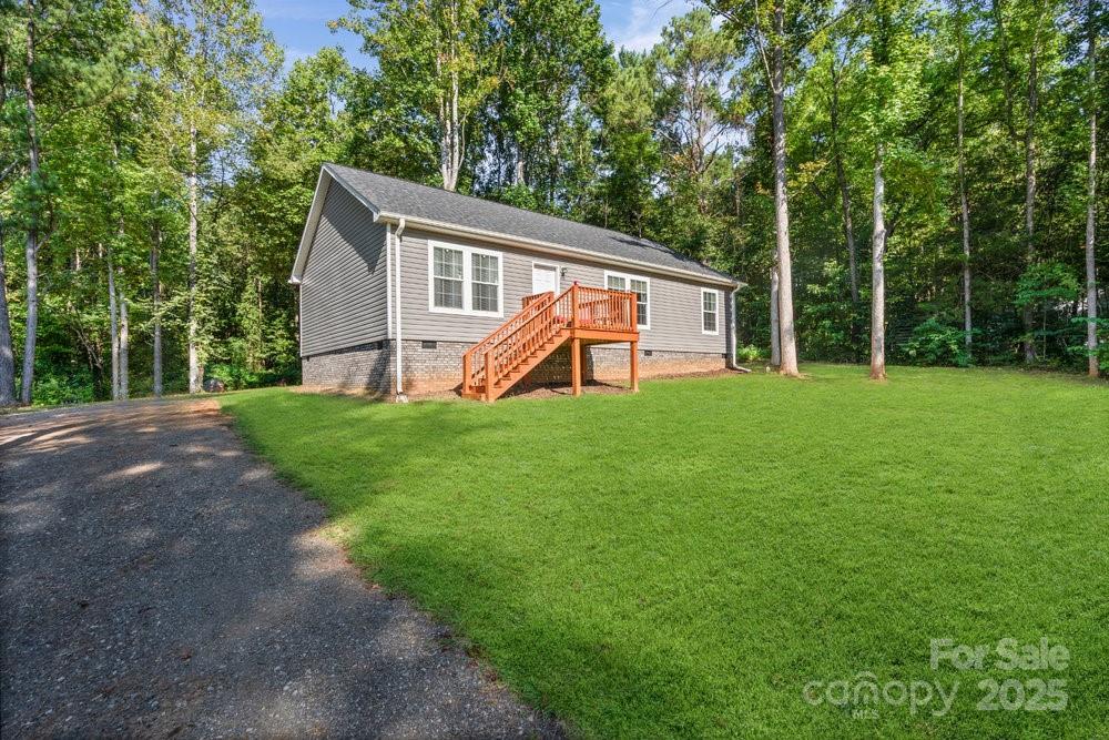 402 Shiloh Road Statesville, NC 28677 - Photo 3 of 34 a view of a house with a yard and sitting area