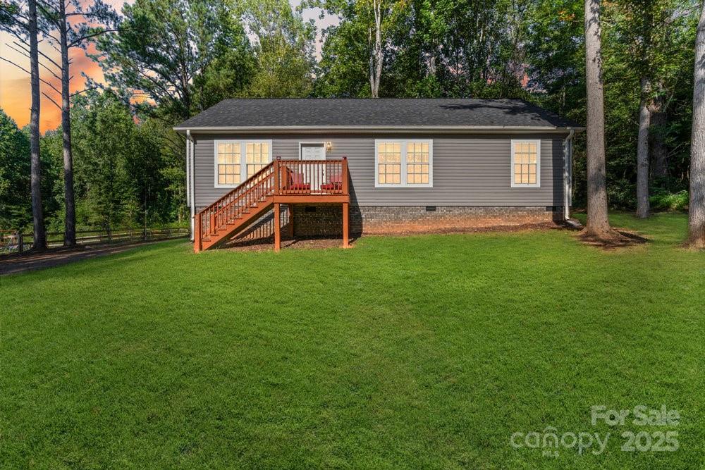 402 Shiloh Road Statesville, NC 28677 - Photo 4 of 34 a view of a house with a backyard
